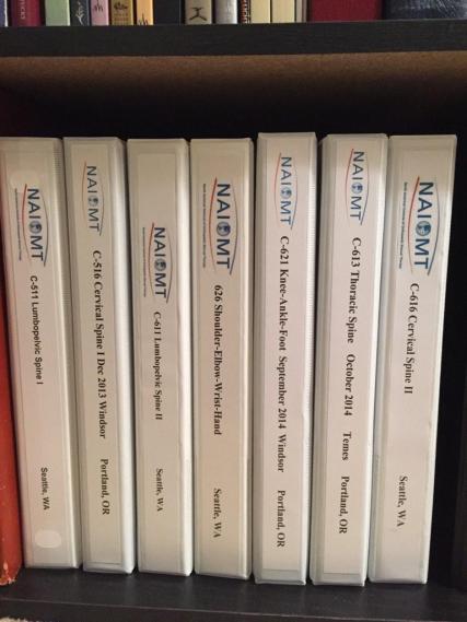 Ryan's Impressive Collection of NAIOMT course manuals.